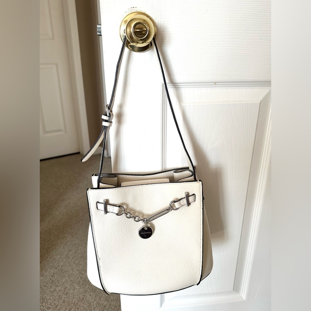 Calvin Klein purse used once. In great condition. Off white. 9x9 inches.